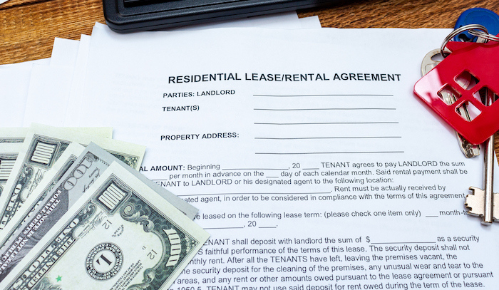 Rental/lease agreement on a table.