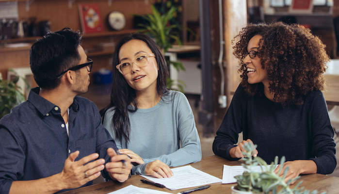 Couple getting mortgage refinance advice.