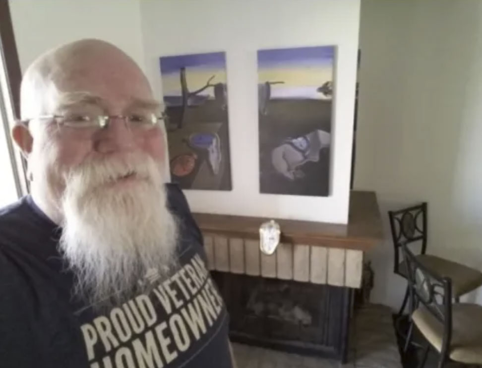 picture of Jeffrey B. in front of a house