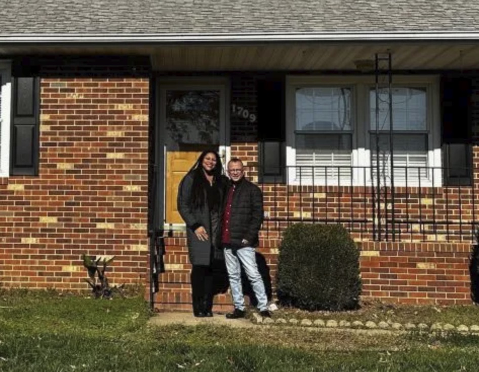 picture of Mark L. in front of a house
