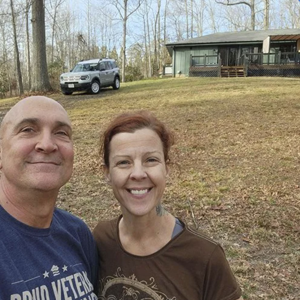 picture of Edward S. in front of a house